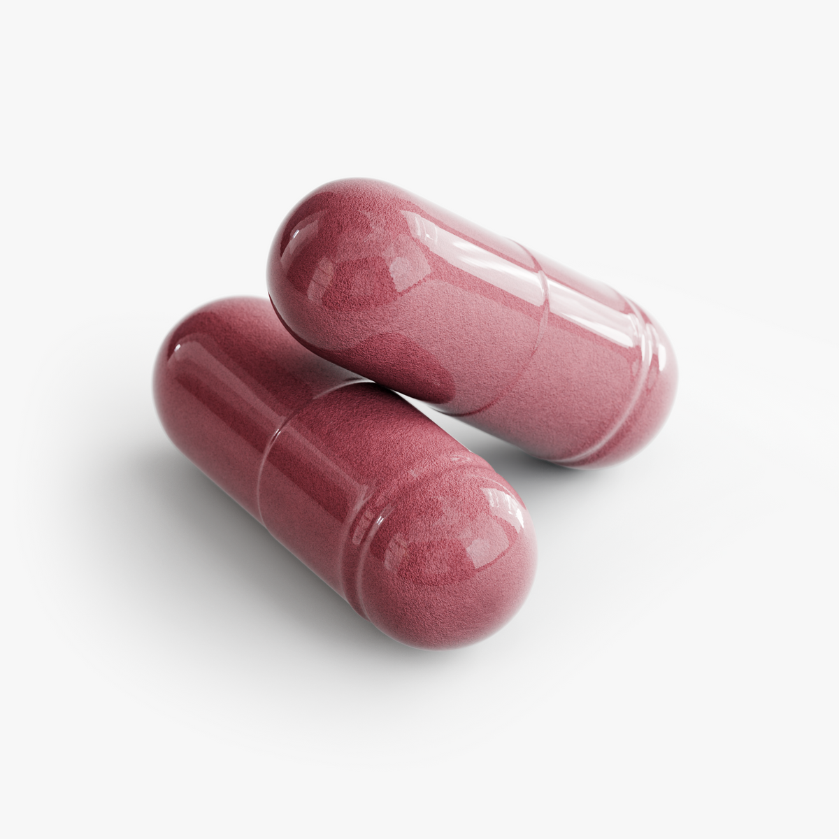Two pink dietary supplement capsules